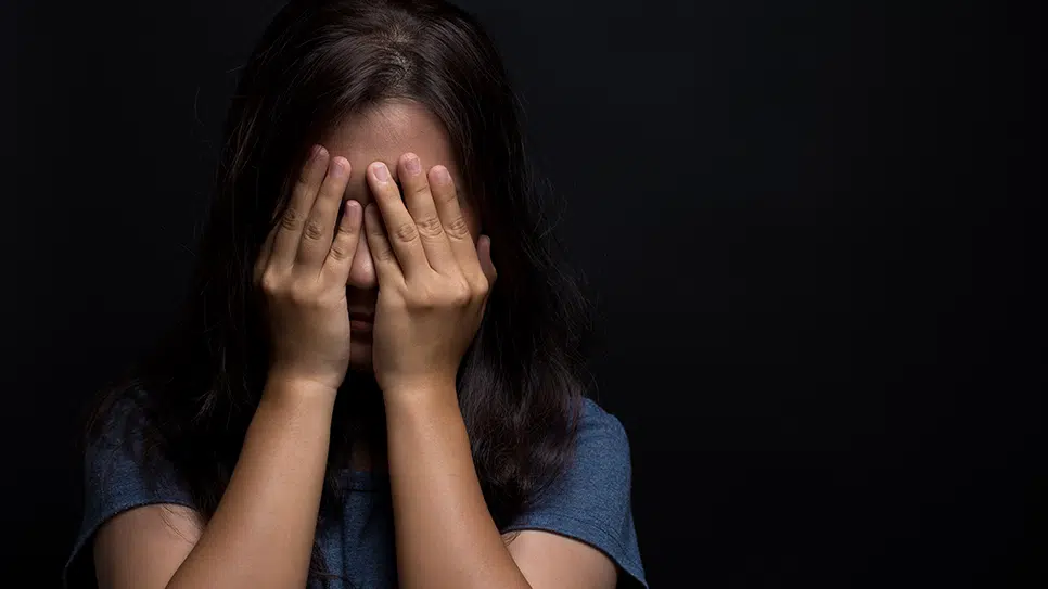 girl covering eyes