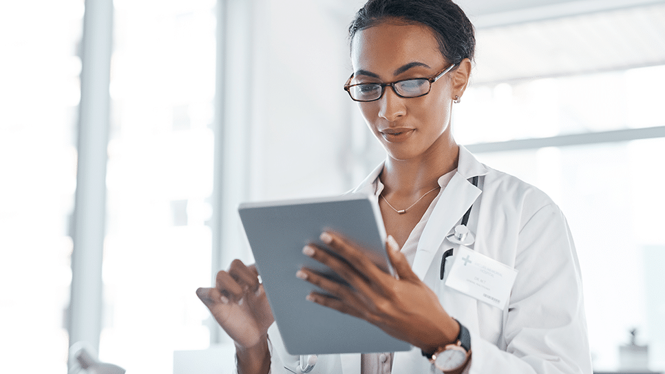 healthcare worker on a tablet