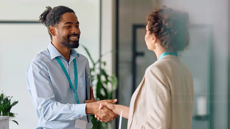 A man and a woman shaking hands