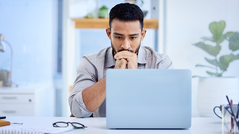 man looking at laptop