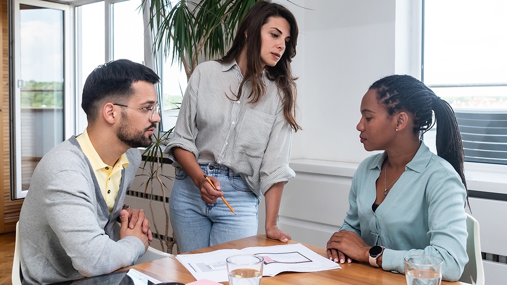 Three work colleagues around a table