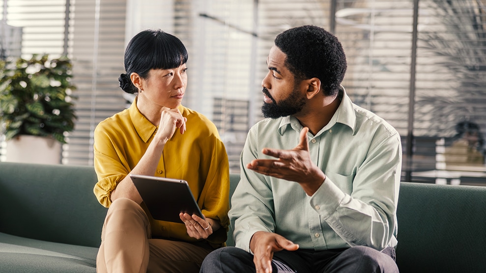 Two colleagues in a discussion
