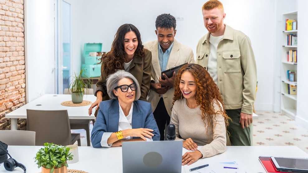 Group of smiling colleagues in an office setting