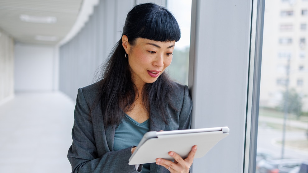 woman on tablet in office space