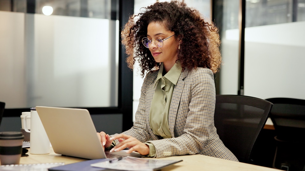 woman typing on laptop